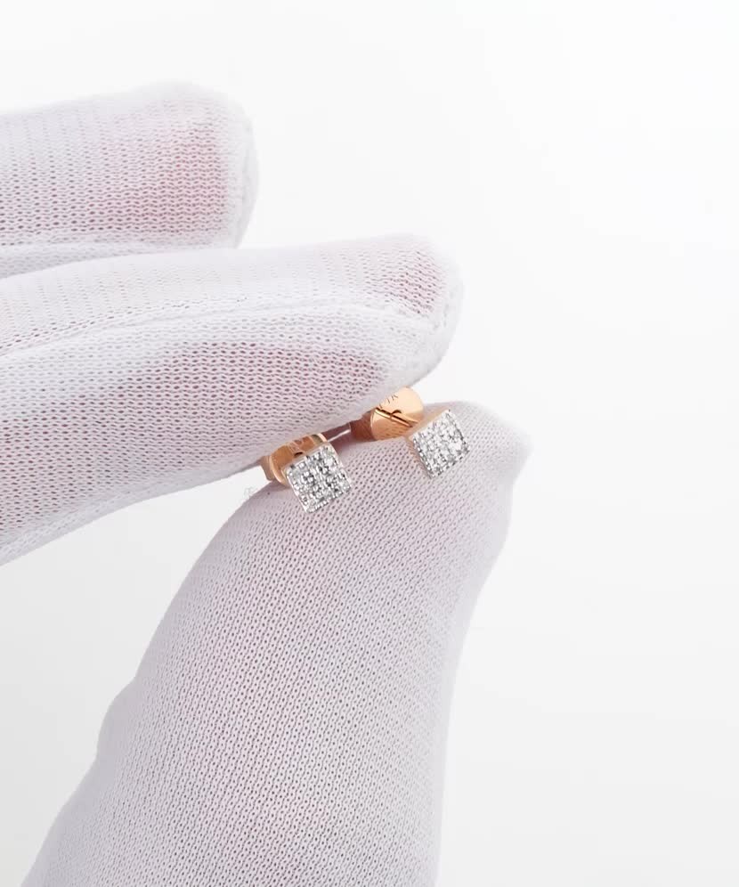 Kultaiset korvakorut timanteilla