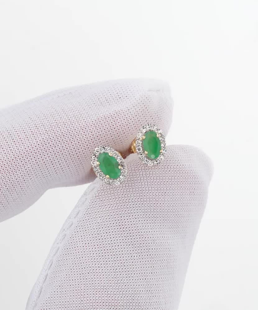 Keltakultaiset korvakorut smaragdeilla ja timanteilla