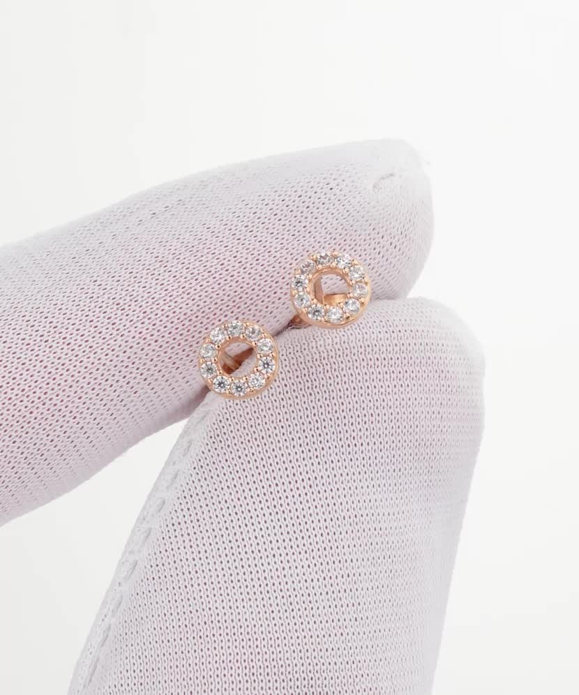 Kultaiset korvakorut zirkoneilla