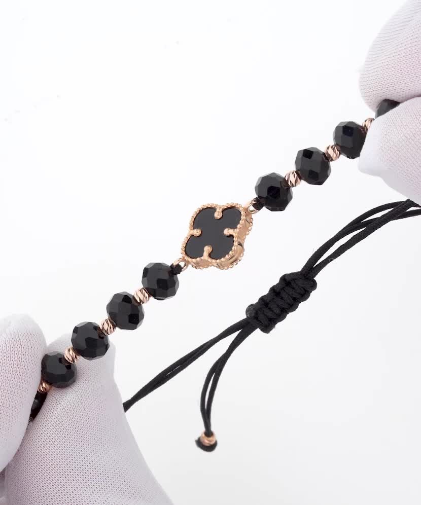 Black string bracelet with gold and onyxes