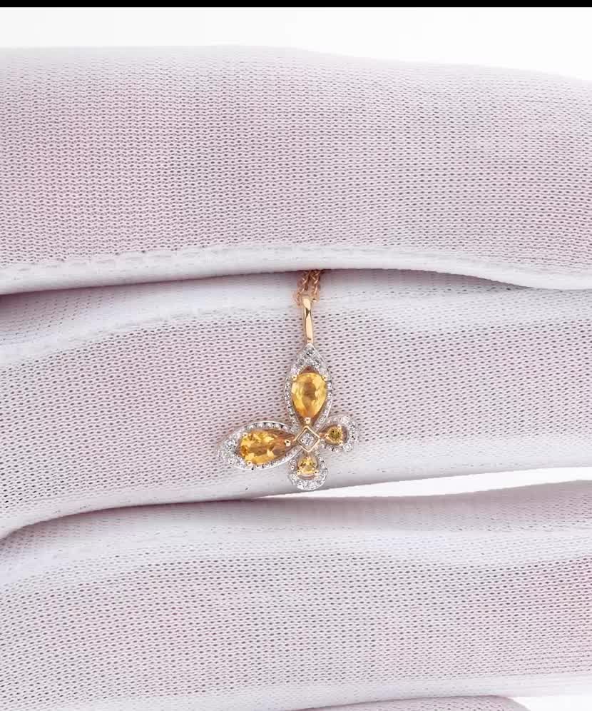 Keltakultainen riipus timanteilla ja sitriineillä