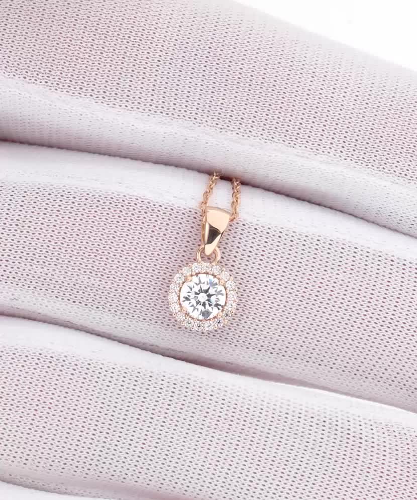 Kultainen riipus zirkoneilla