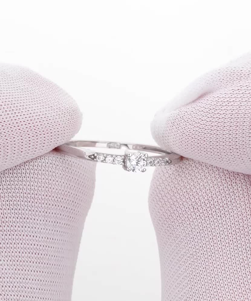 White gold ring with zircons