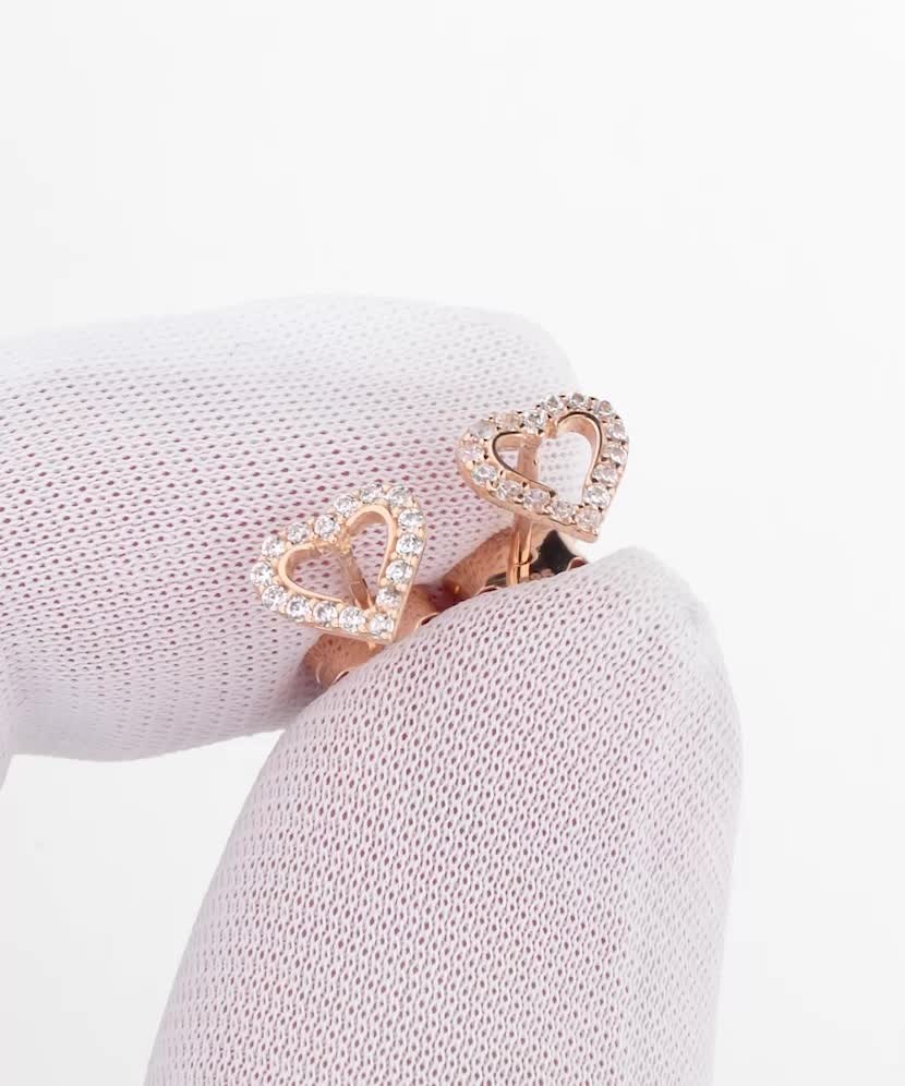 Kultaiset korvakorut zirkoneilla "sydän"