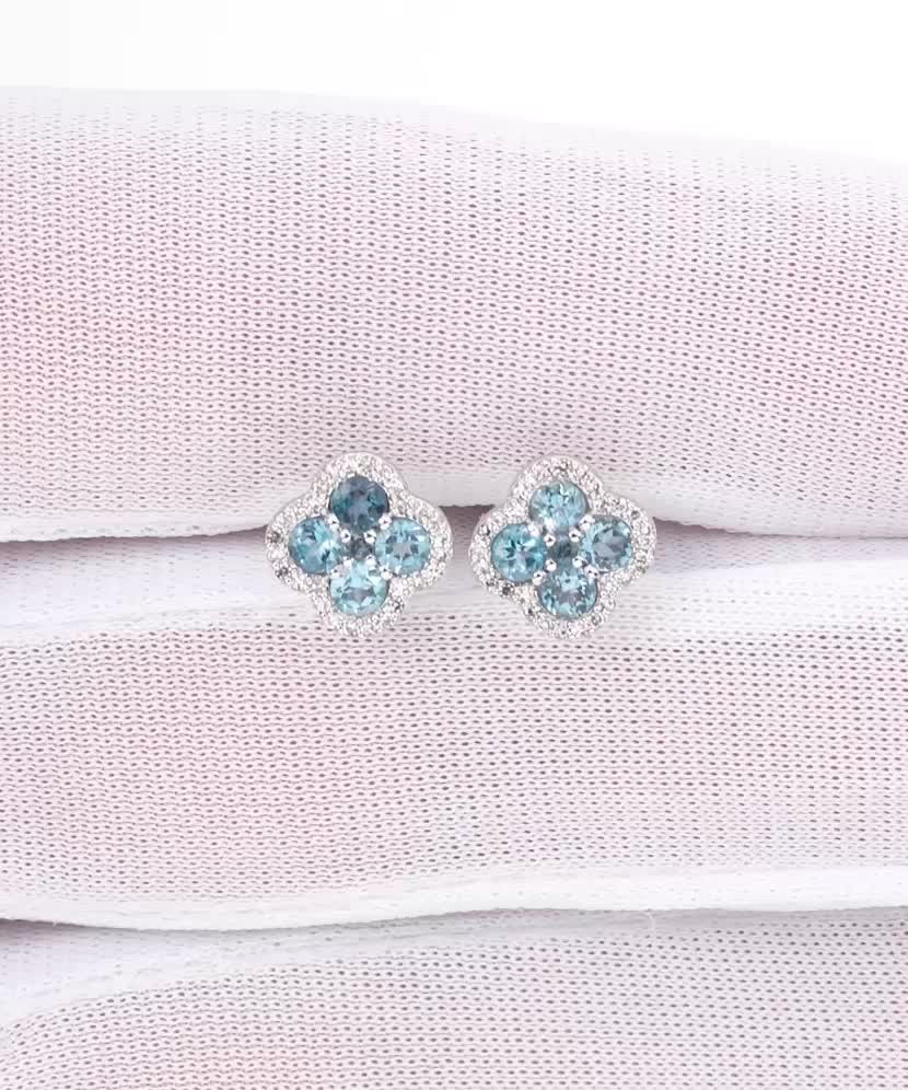 Valkokultaiset korvakorut topaaseilla ja timanteilla