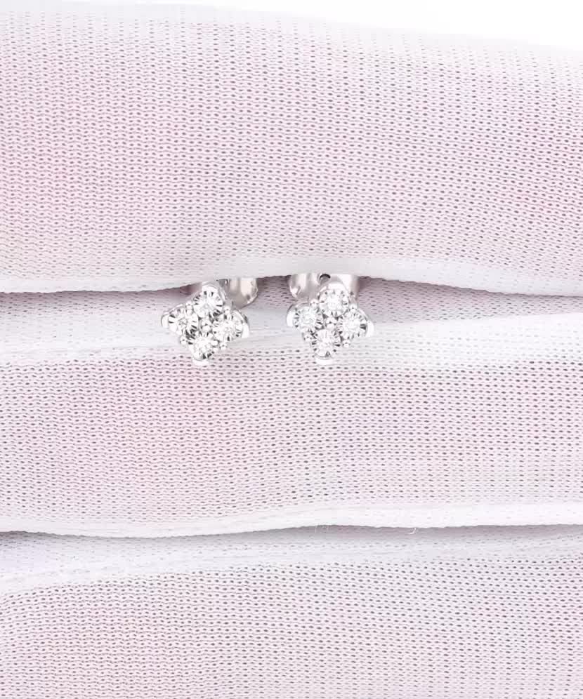 Valkokultaiset korvakorut timanteilla