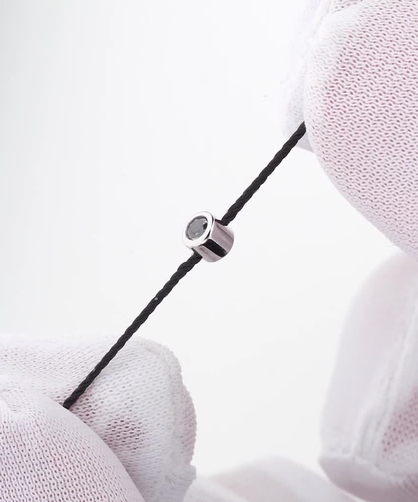 Black string bracelet with black diamond and white gold