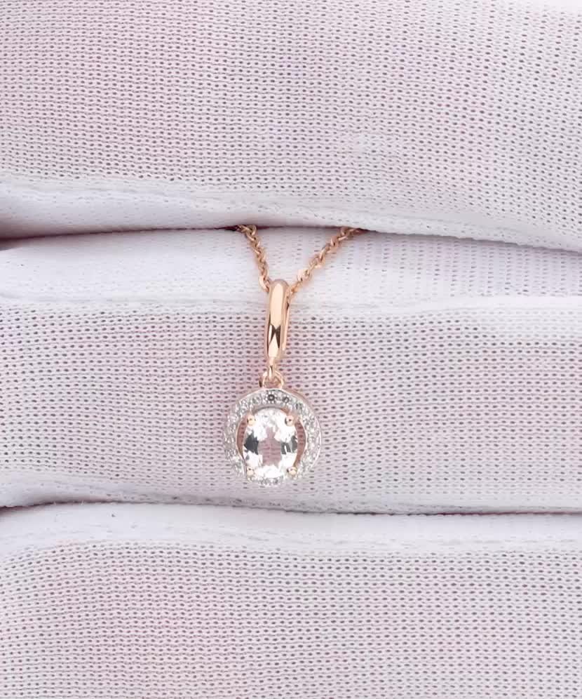 Gold pendant with white topaz and diamonds