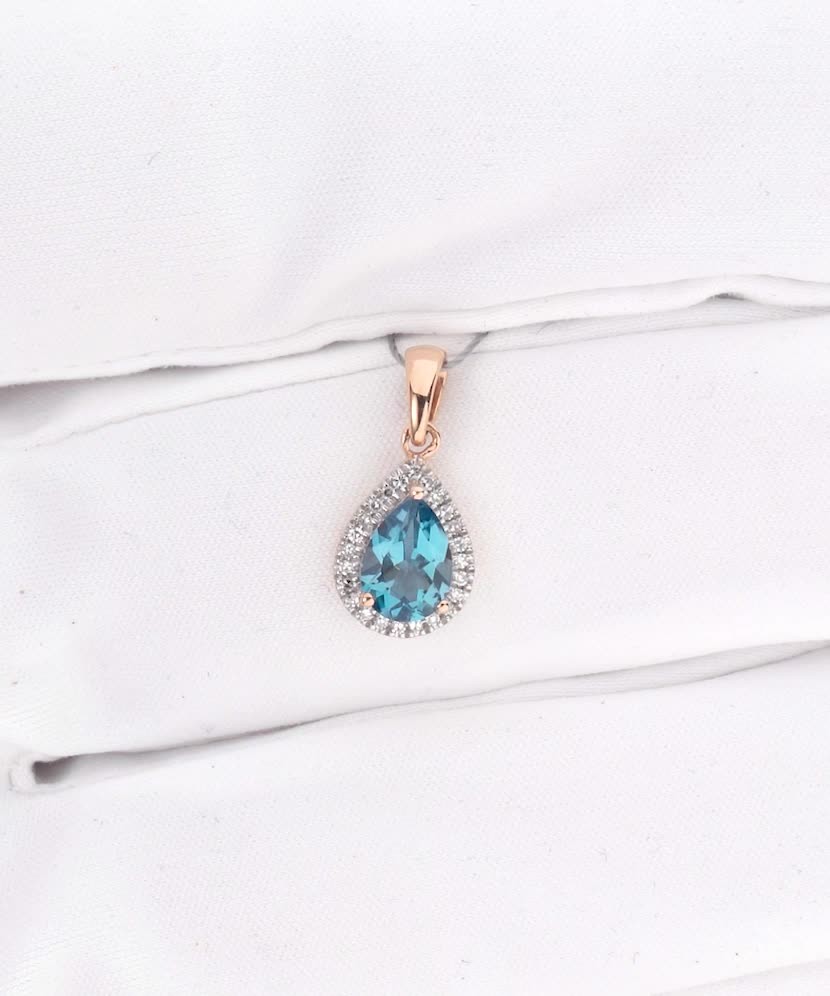 Gold pendant with diamonds and London topaz