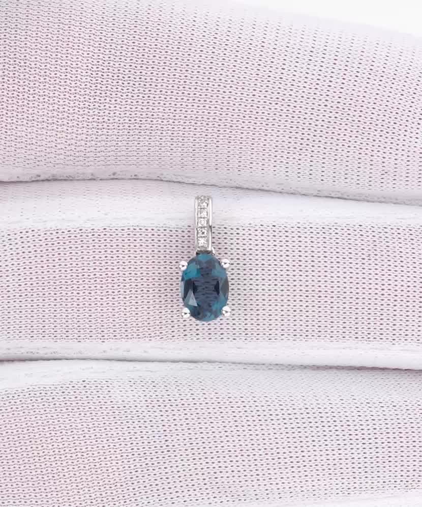 White gold pendant with diamonds and London topaz