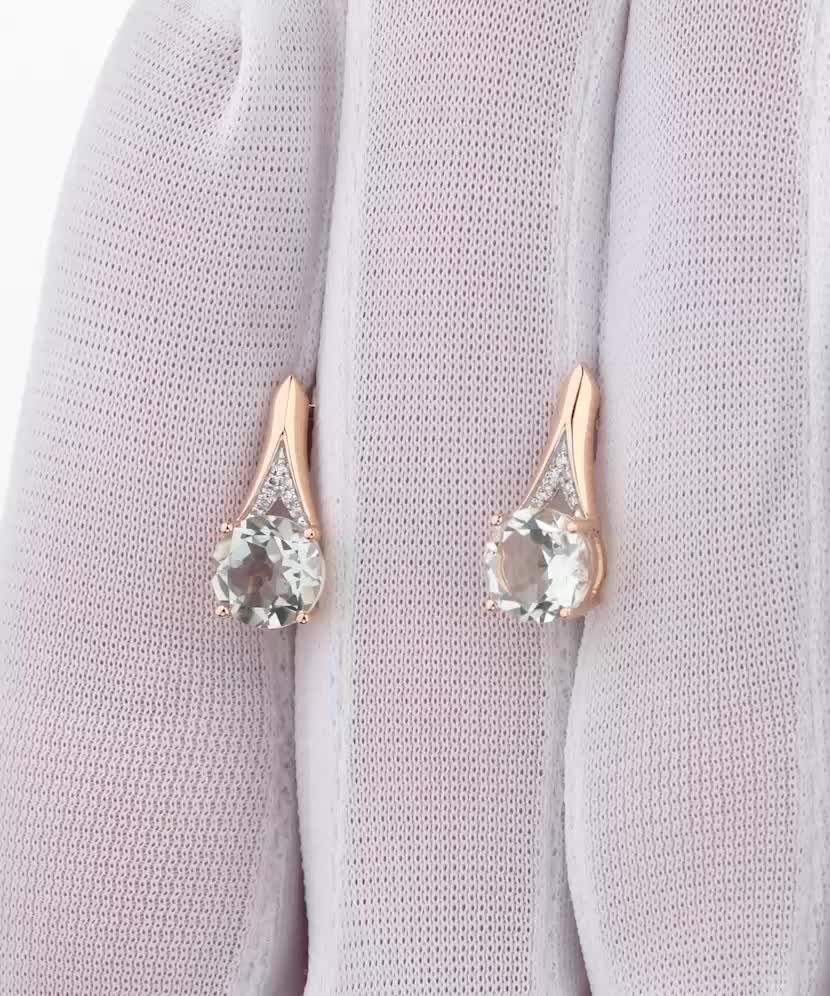 Gold earrings with diamonds and topazes