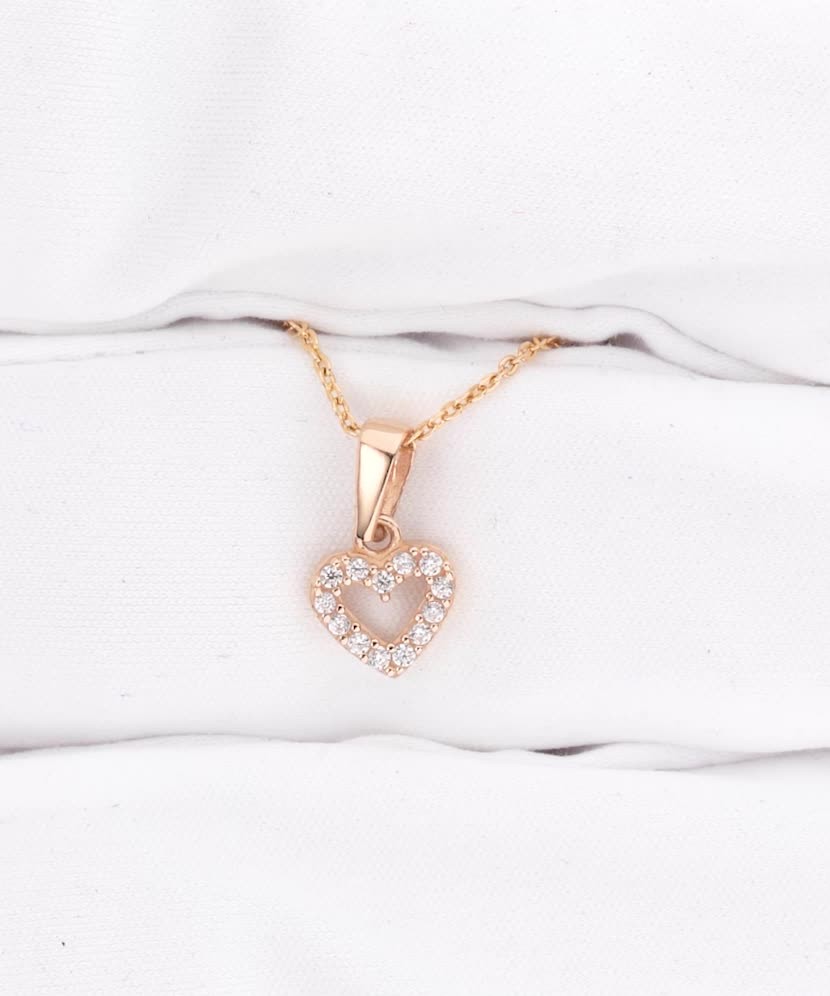 Gold pendant with zircons "heart"