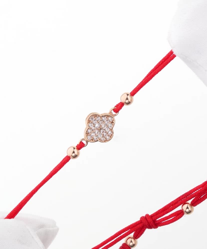 Red string bracelet with gold zirconia pendant