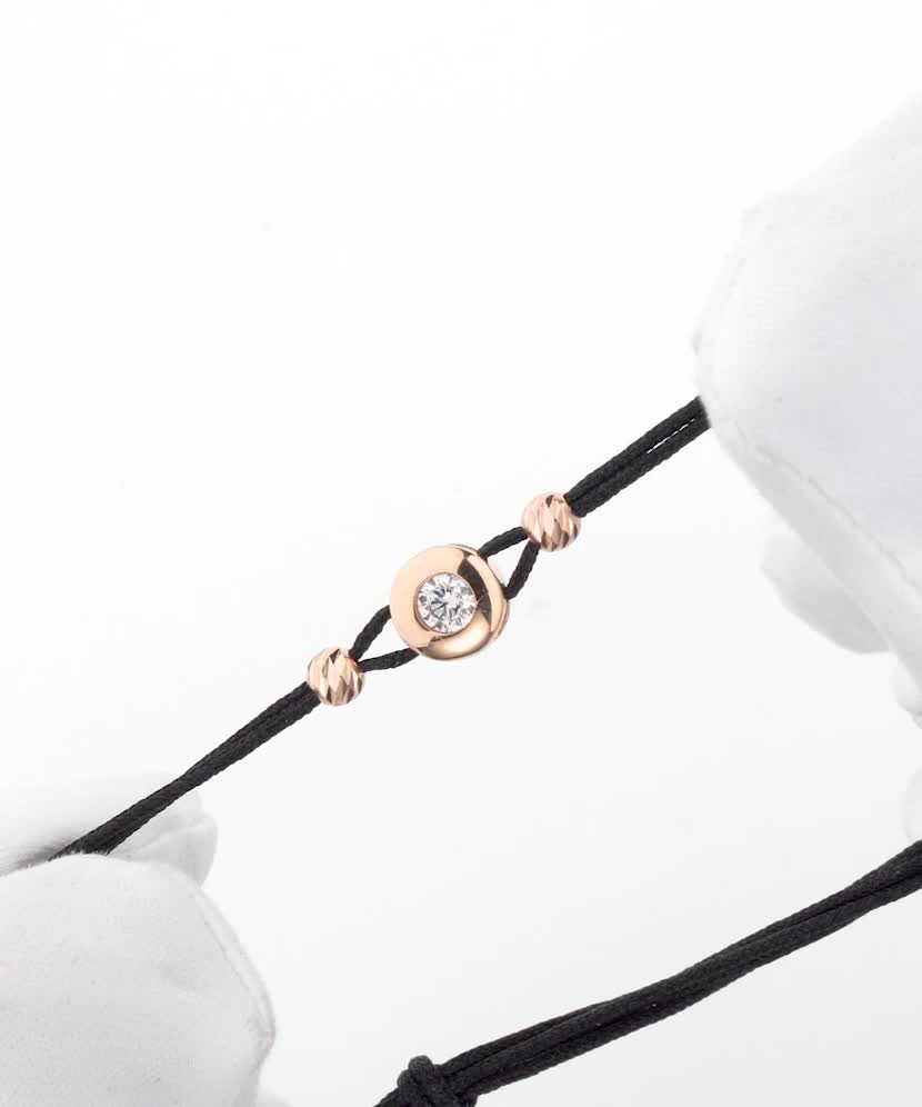 Black string bracelet with gold zirconia pendant