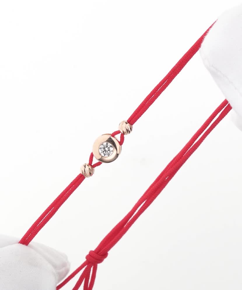 Red string bracelet with gold zirconia pendant
