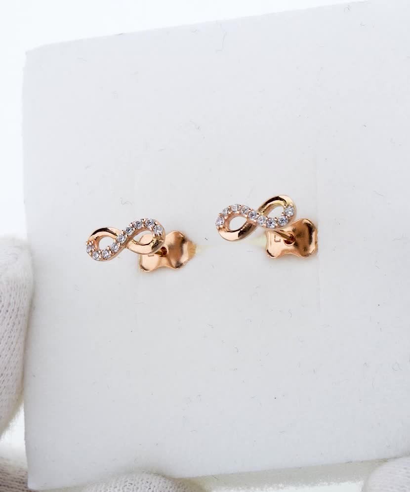Gold earrings with zircons "infinity"