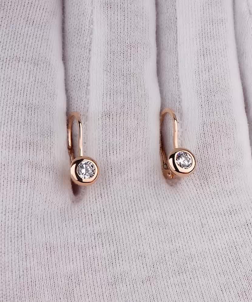 Gold earrings with zircons