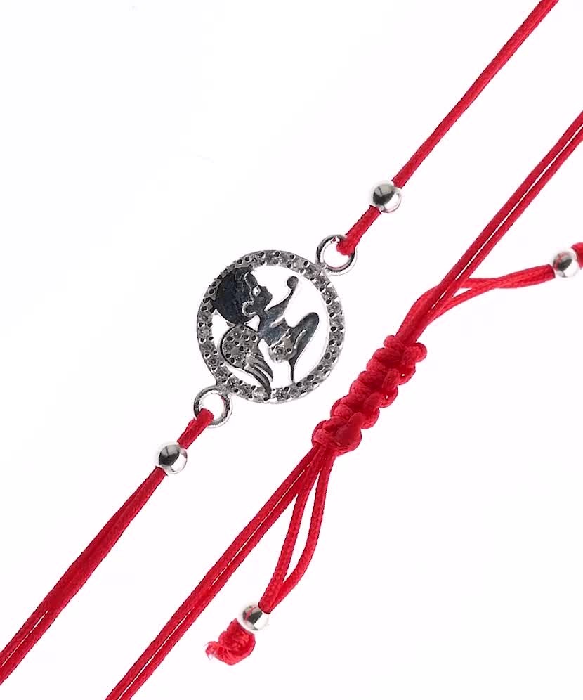 Red string bracelet with a silver pendant "angel"