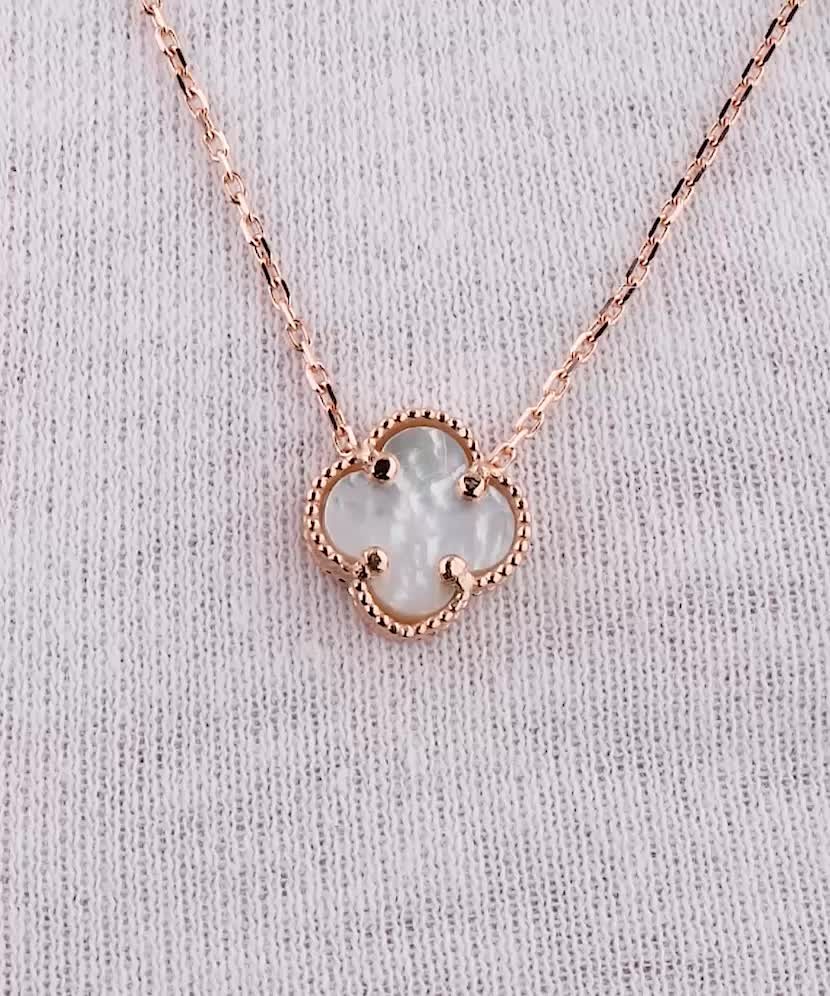 Gold chain with nacre pendant