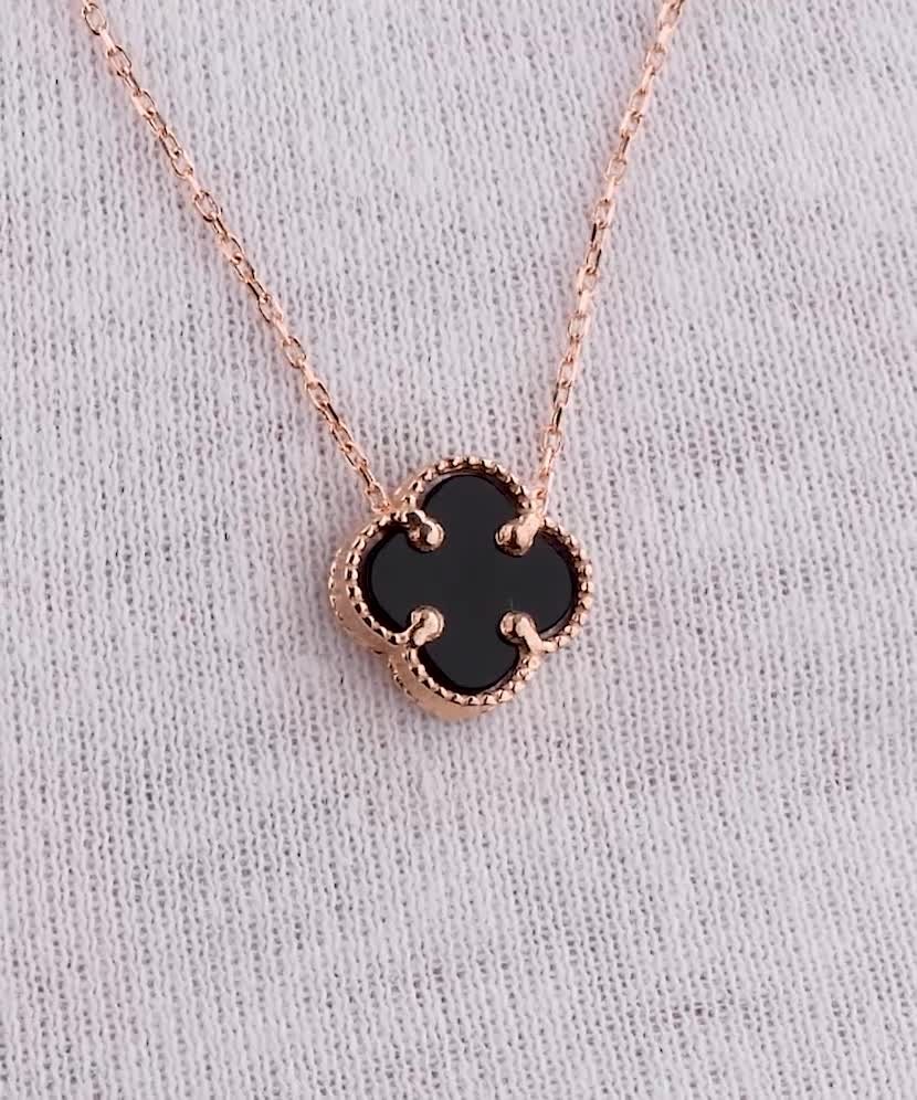 Gold chain with onyx pendant