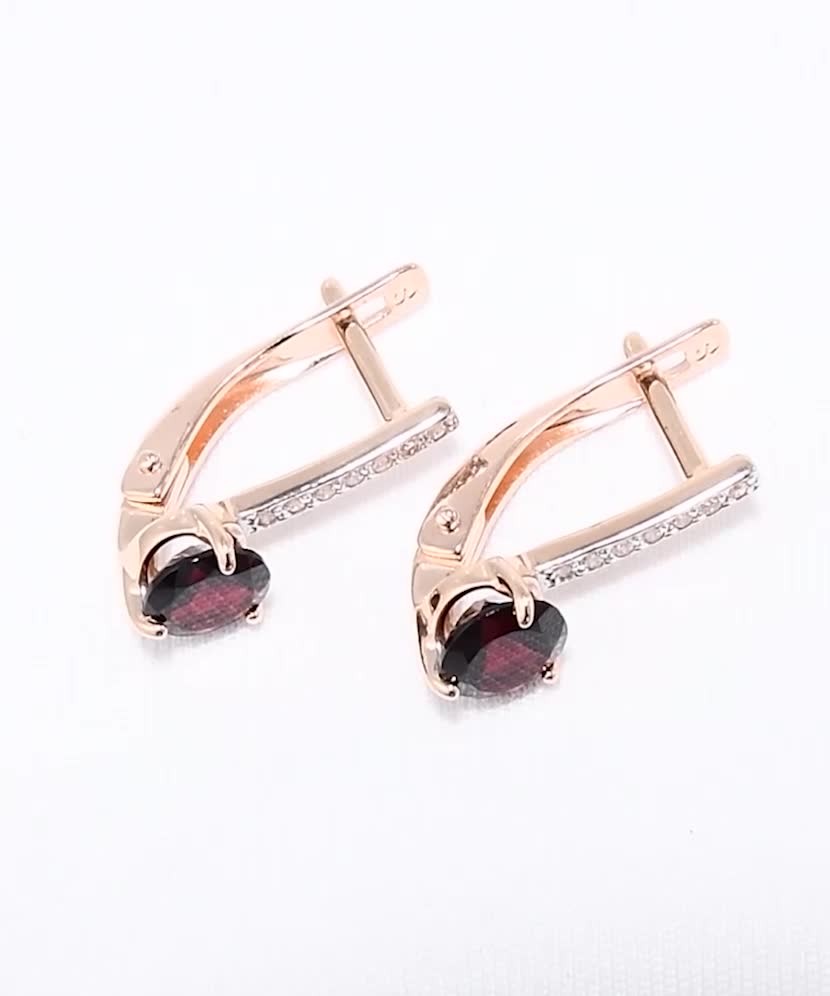 Gold earrings with garnets and zircons