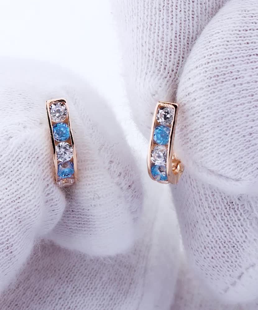 Gold children's earrings with zircons
