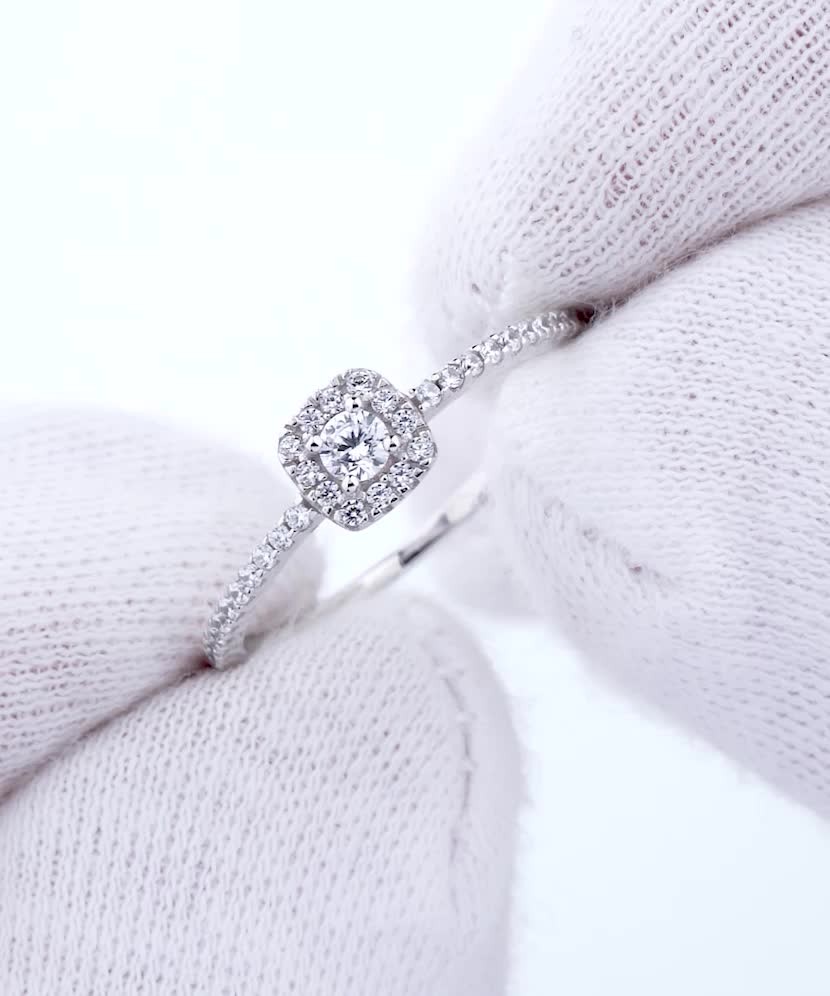 White gold ring with zircons