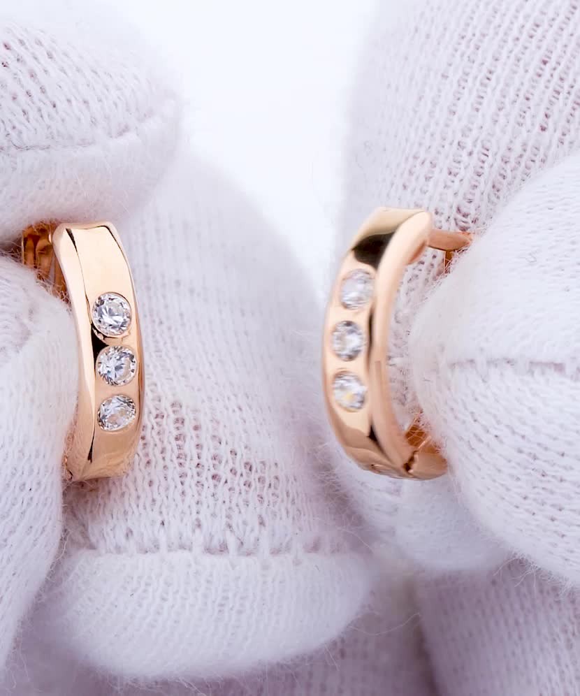 Gold hoop earrings with zircons