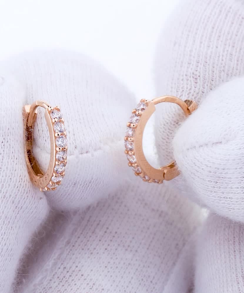 Gold hoop earrings with zircons