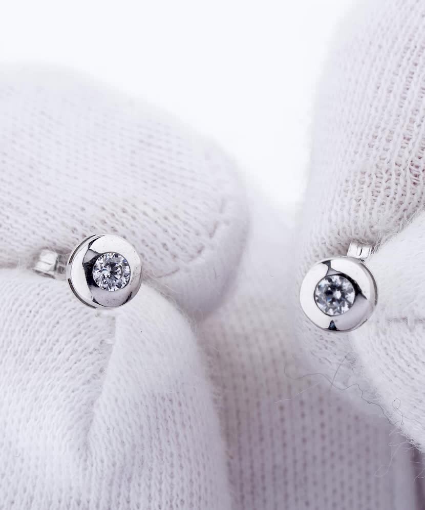 White gold earrings with zircons