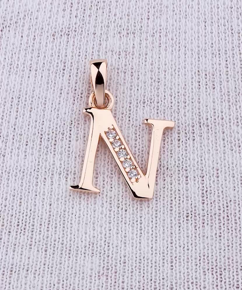 Gold pendant with zircons Letter N