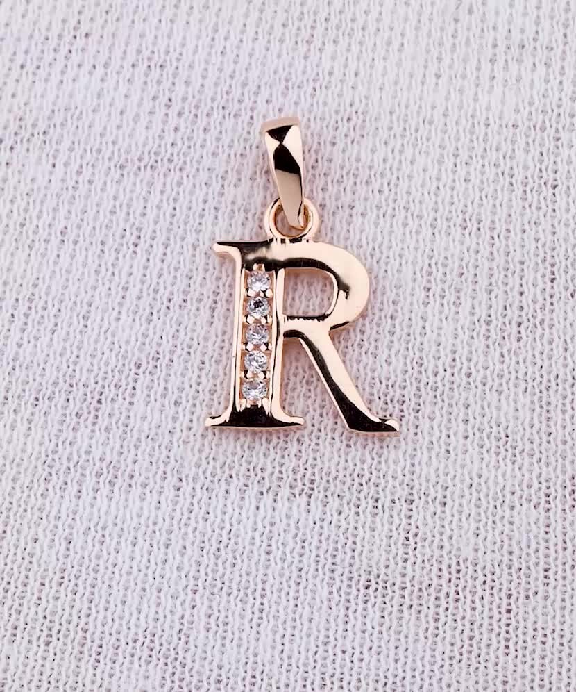 Gold pendant with zircons Letter R
