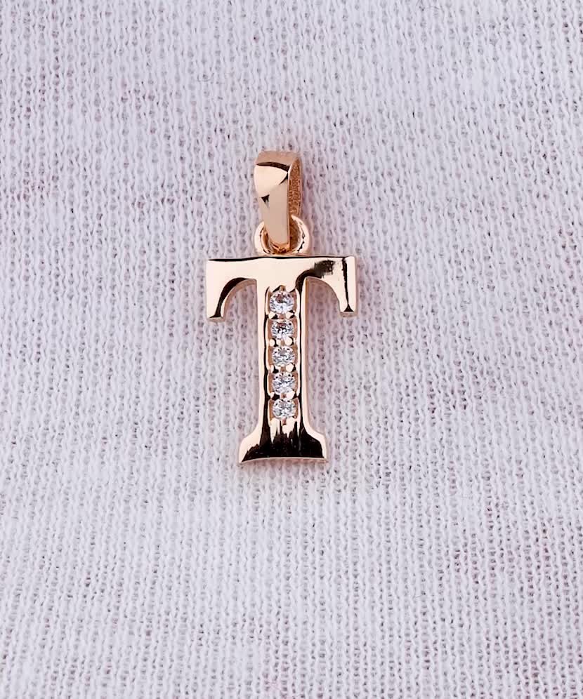 Gold pendant with zircons Letter T