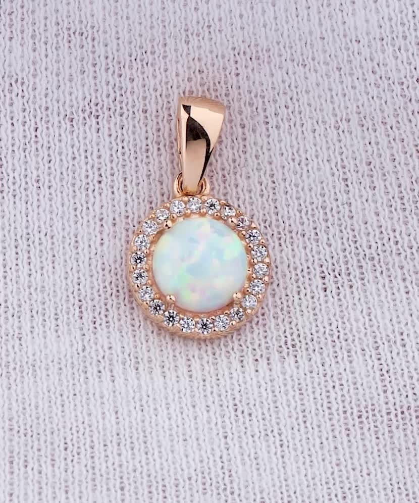 Gold pendant with zircons and opal