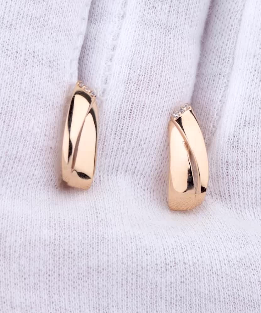 Gold earrings with zircons