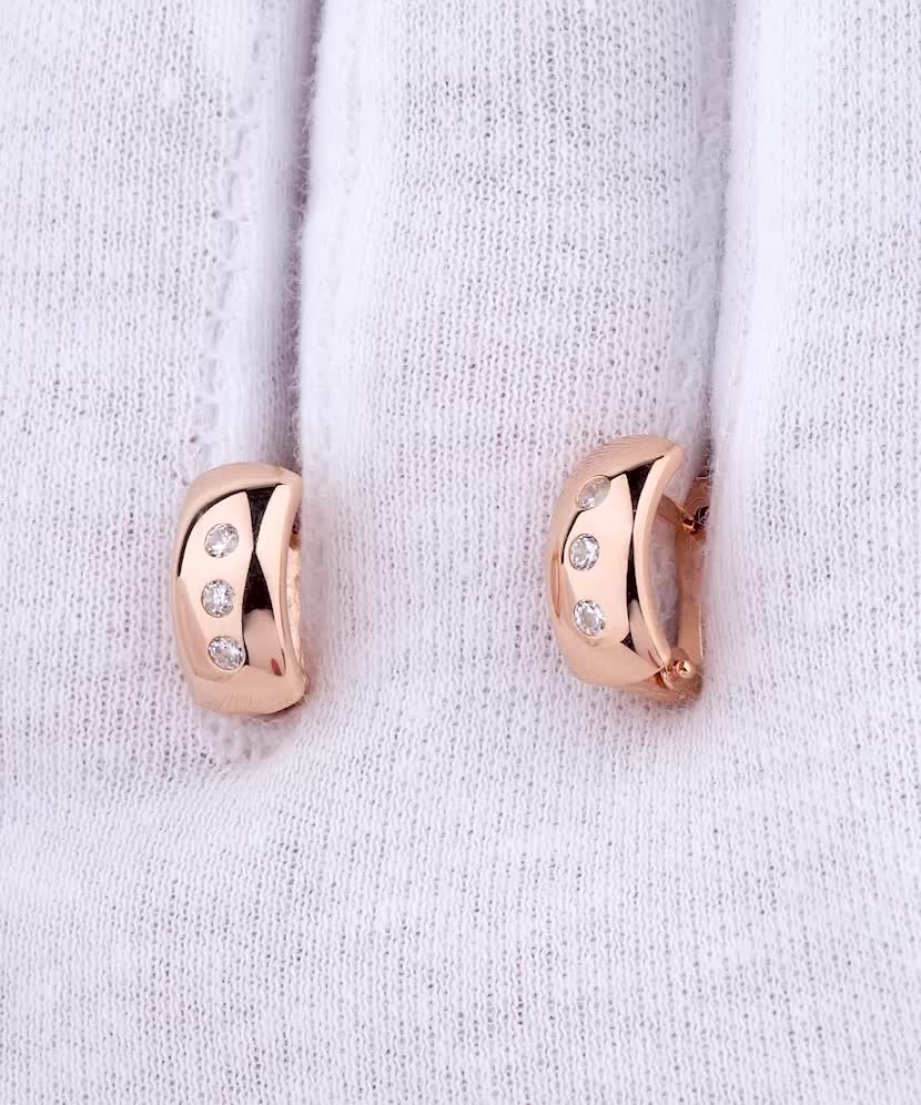 Gold earrings with zircons