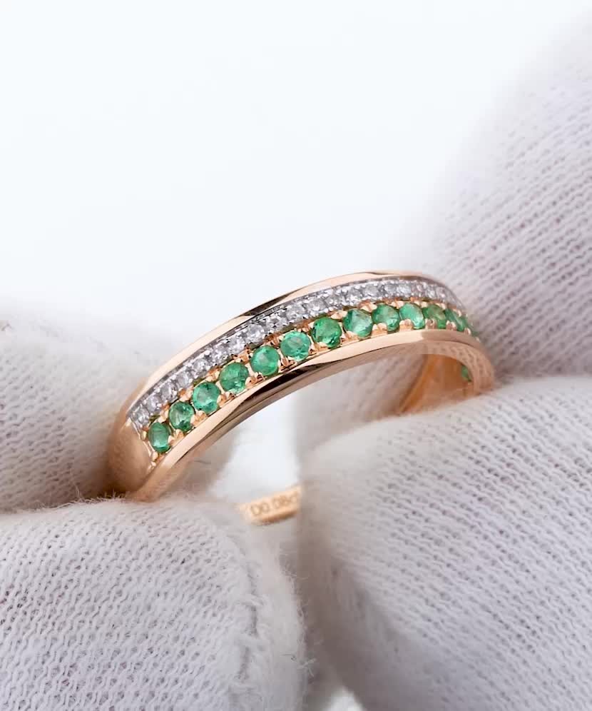 Gold ring with diamonds and emeralds