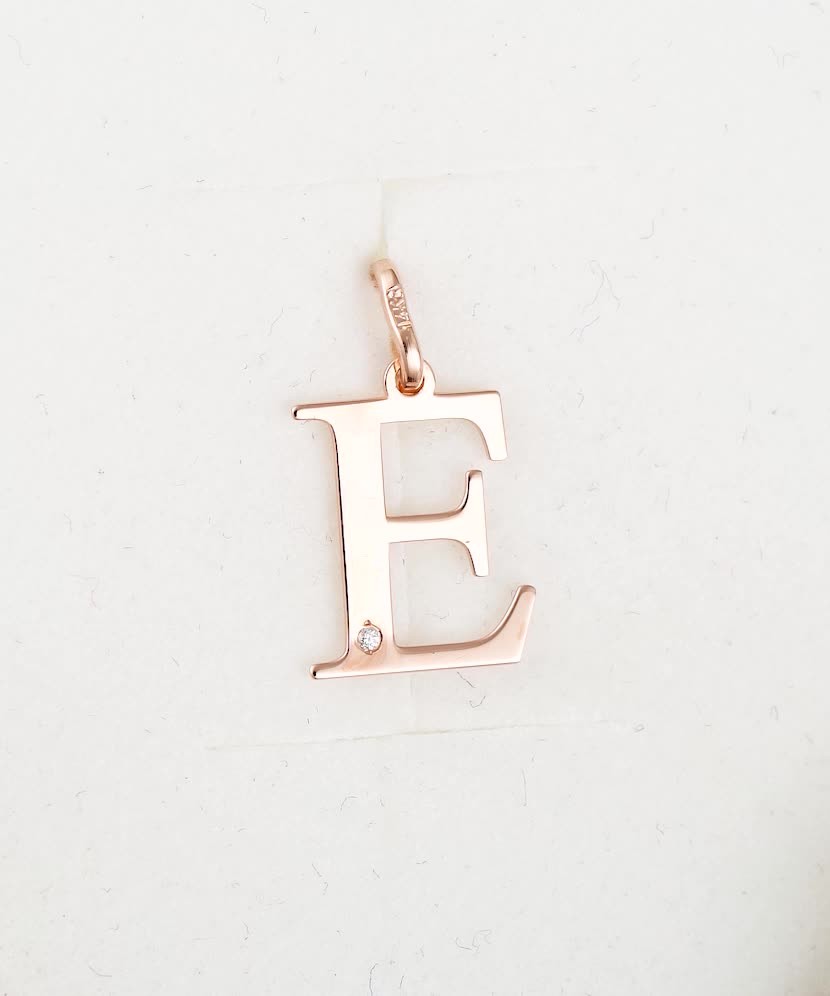 Gold pendant with diamond letter E
