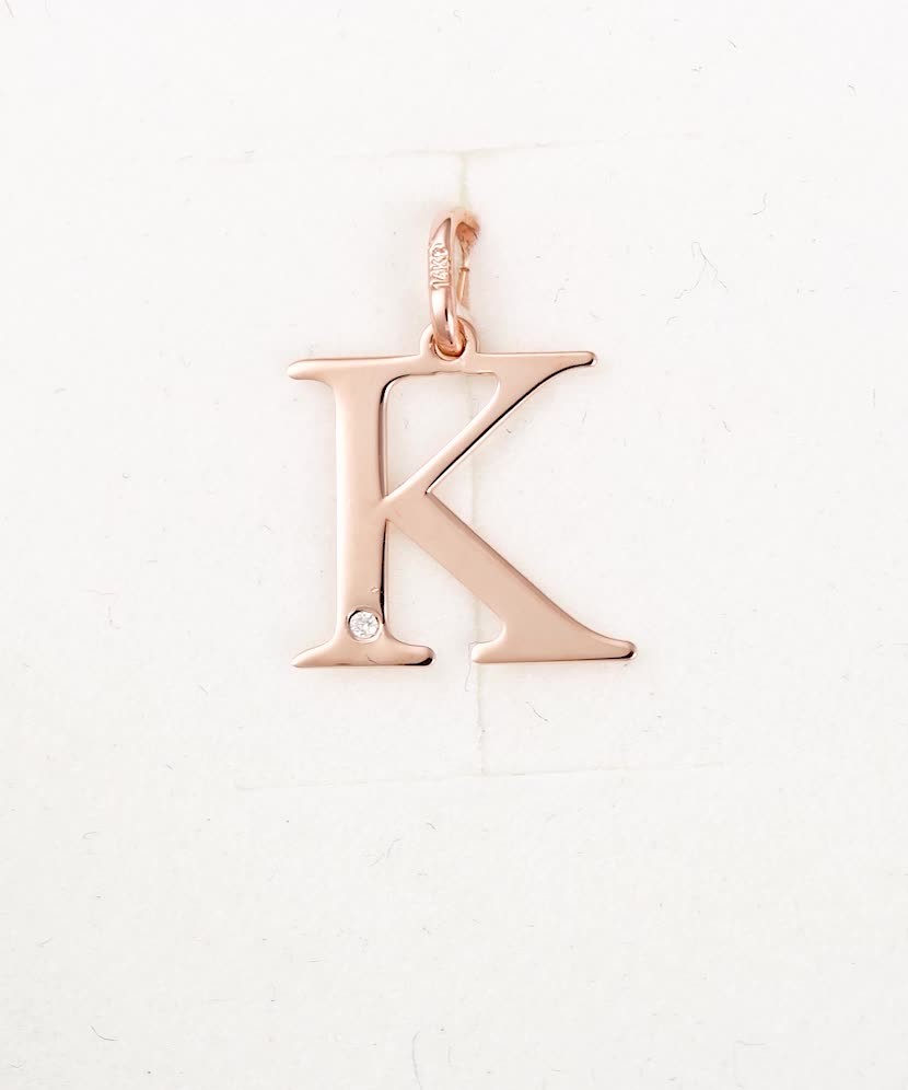 Gold pendant with diamond letter K