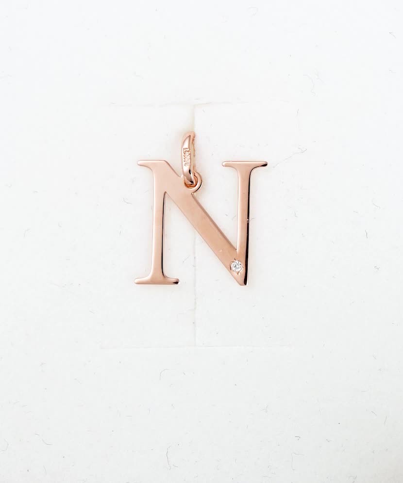 Gold pendant with diamond letter N
