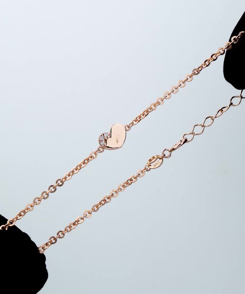 Kultainen rannekoru zirkonailla "sydän"