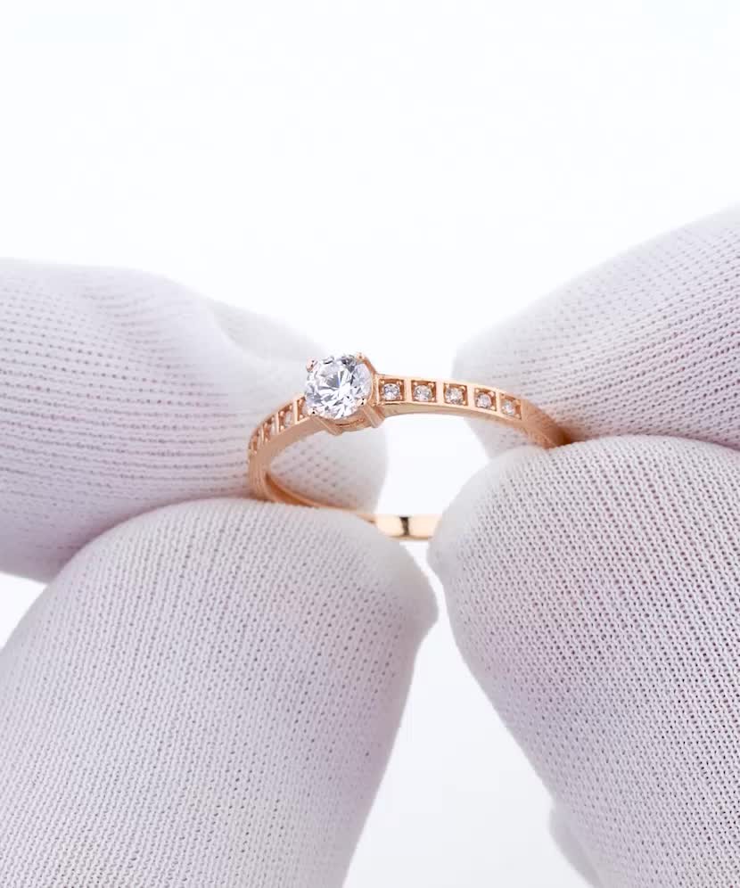 Gold ring with zircons