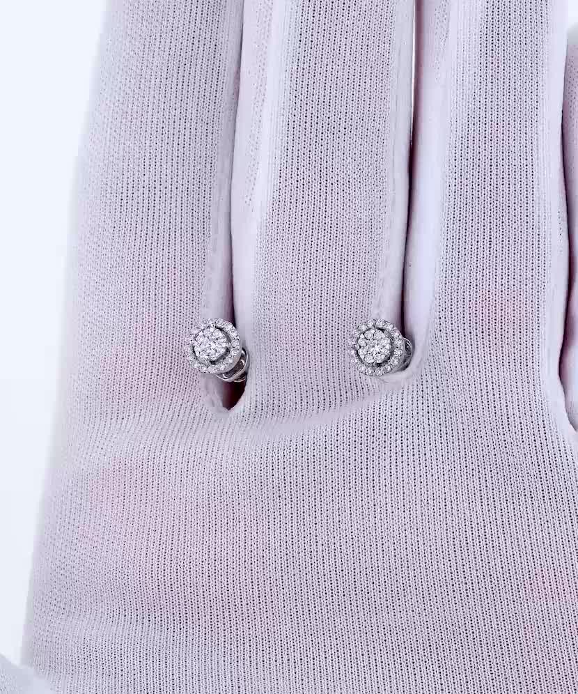 Valkokultaiset korvakorut timanteilla