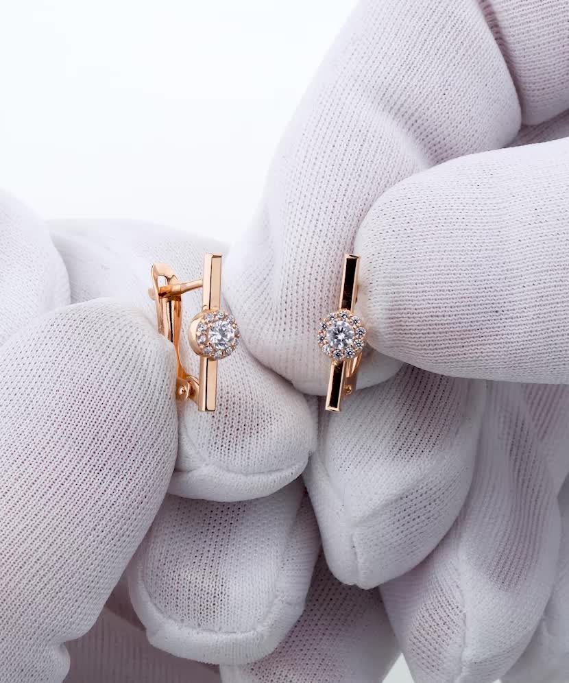 Kultaiset korvakorut zirkoneilla