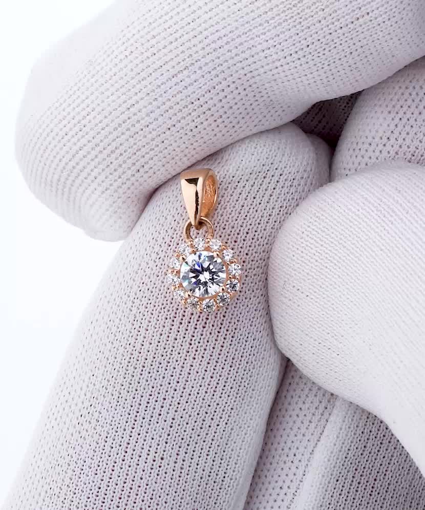 Gold pendant with zircons