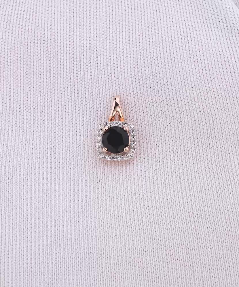 Gold pendant with diamonds and spinel